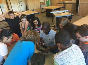 Mr. Fatel demonstrates and activity in front of his 6th grade class in Tech Ed.