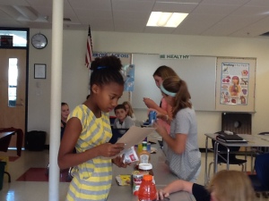 6th Graders inspecting nutrition facts in Health.